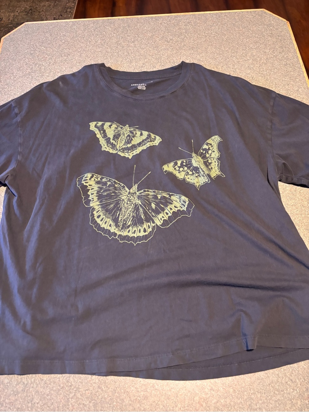 American Eagle Outfitters Black Tee with Yellow-Green Butterfly Graphic